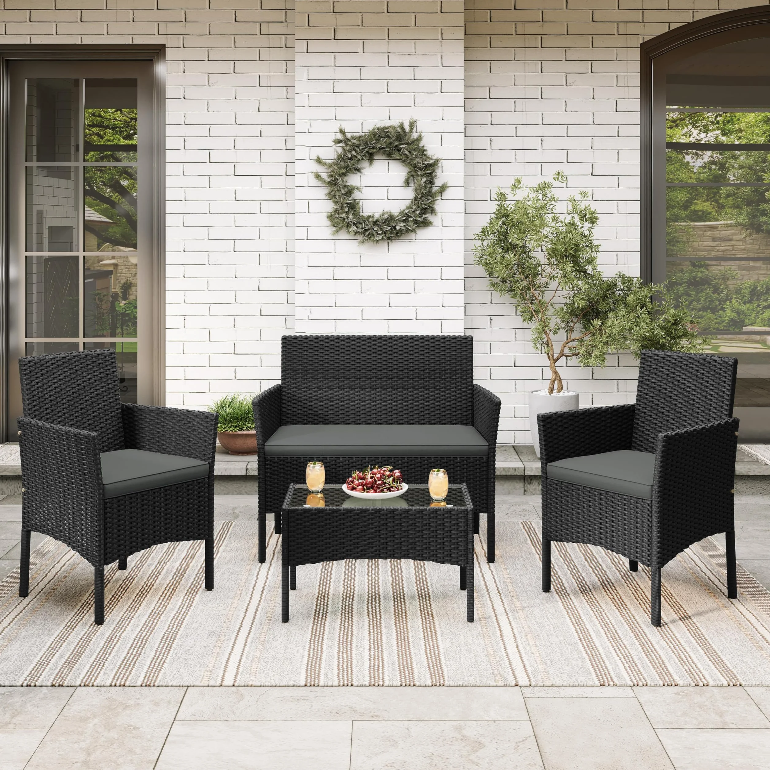 Yaheetech Conjunto Jardín 4 Piezas Muebles Ratán Exterior con Sofá 2 Plazas, Sillones, Cojines y Mesa Vidrio Negro/Gris